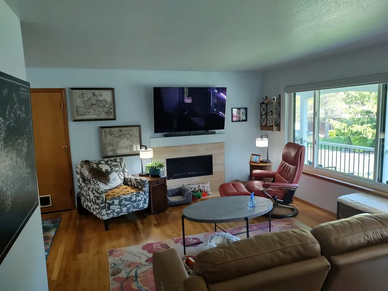 Living room with freshly painted pale blue walls and white trim